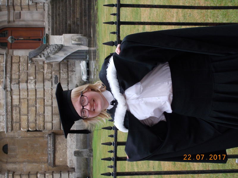 Photo of Chloe Agar (blog post writer) smiling and wearing subfusc at her graduation, in front of the Radcliffe Camera